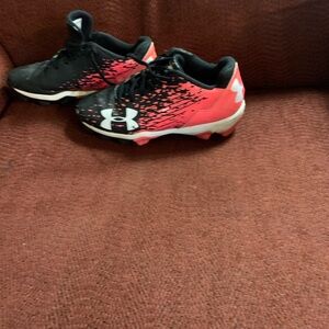 Fair to good condition. Pink and black under armor cleats.